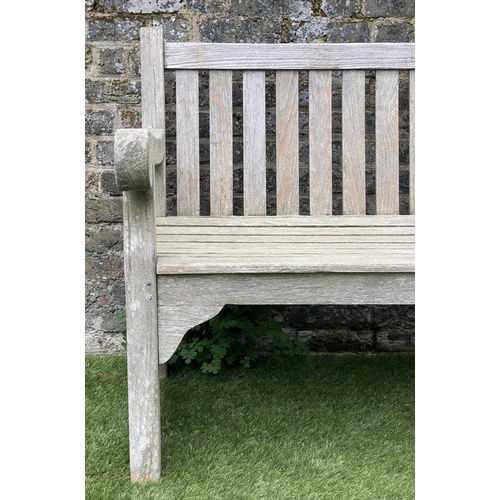 131 - GARDEN BENCH, weathered teak of large size and substantial slatted construction, 180cm W.