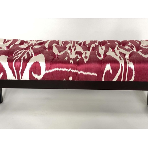 397 - WINDOW SEAT, batik style crimson and buttoned upholstery, 111cm W.