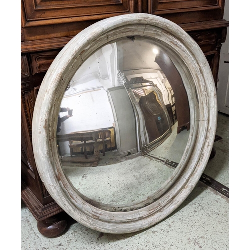 151 - CONVEX MIRROR, 122cm D by Paulo Moschino in a distressed finish.