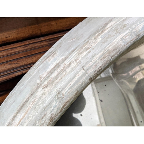 151 - CONVEX MIRROR, 122cm D by Paulo Moschino in a distressed finish.
