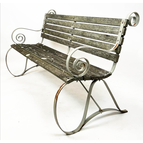 578 - GARDEN BENCH, wrought iron strap work frame with weathered teak slats, 157cm W.