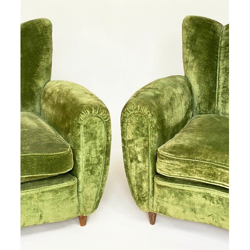 156 - WING ARMCHAIRS, a pair, green velvet upholstered with 'cloud' backs, rounded arms and tapering walnu... 