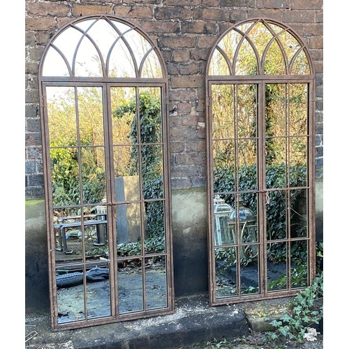 573 - ARCHITECTURAL GARDEN MIRRORS, a pair, gated design, 180cm x 75cm. (2)