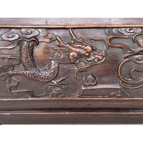 124 - CHINESE LOW TABLE/STOOL, 19th century Rosewood with scroll and carved side panels, 45cm D x 82cm W x... 