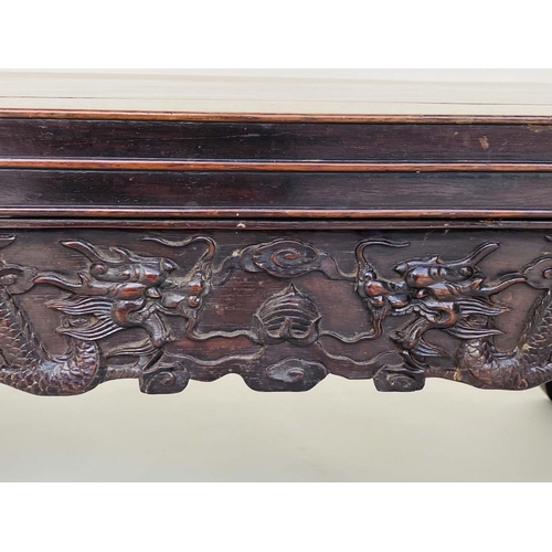 124 - CHINESE LOW TABLE/STOOL, 19th century Rosewood with scroll and carved side panels, 45cm D x 82cm W x... 