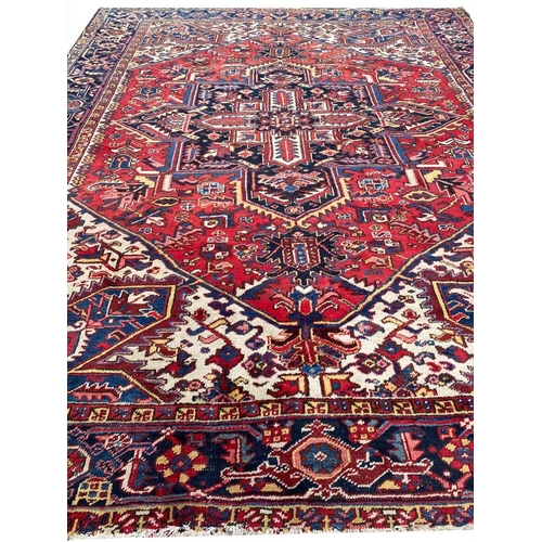 69 - ANTIQUE PERSIAN HERIZ CARPET, 310cm x 245cm.