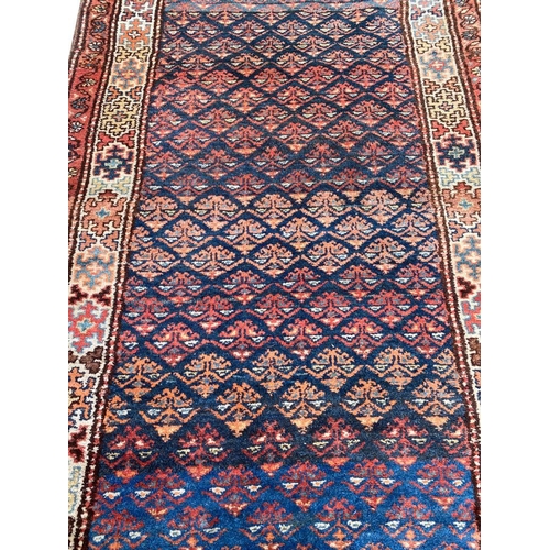 74 - ANTIQUE KURDISH RUNNER, 290cm x 100cm.