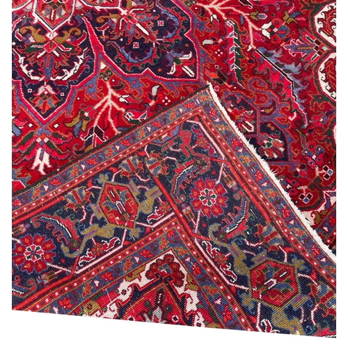 76 - PERSIAN HERIZ CARPET, 325cm x 230cm.