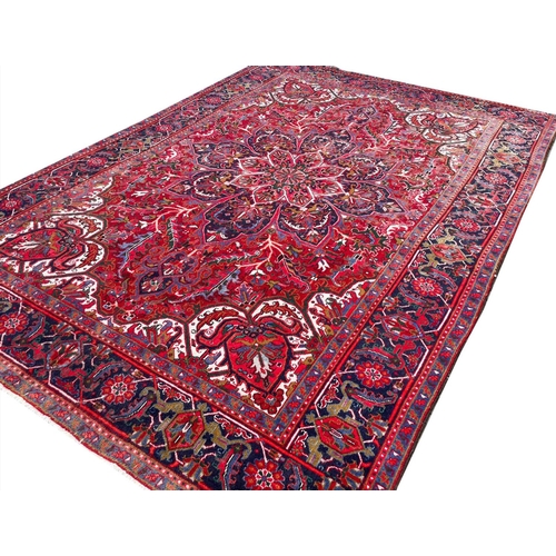 76 - PERSIAN HERIZ CARPET, 325cm x 230cm.