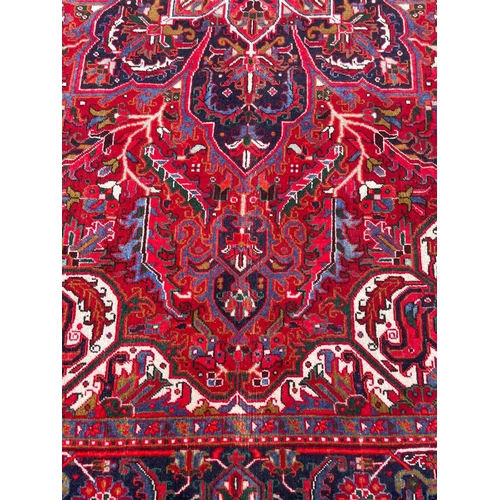 76 - PERSIAN HERIZ CARPET, 325cm x 230cm.