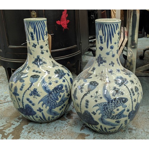 450 - BOTTLE VASES, a pair, 60cm H, Chinese Export style blue and white ceramic. (2)