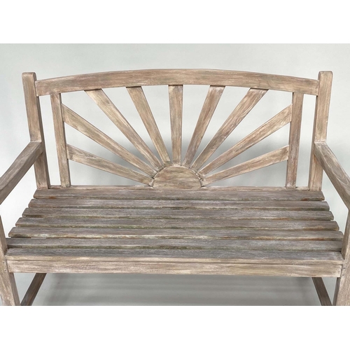 126 - SUNBURST GARDEN BENCH, weathered teak of slatted construction with sunburst arched back, 120cm W.