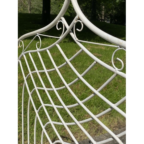 132 - GARDEN BENCH, folding wrought iron and painted with crest back, slatted seat and fold down arms, 115... 