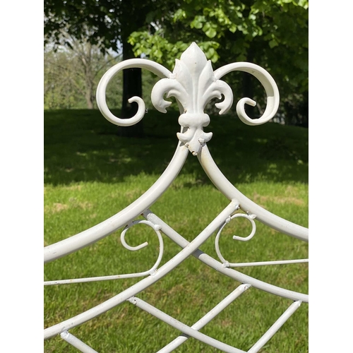 132 - GARDEN BENCH, folding wrought iron and painted with crest back, slatted seat and fold down arms, 115... 