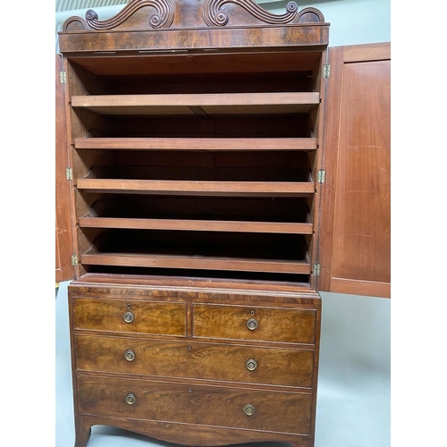 96 - LINEN PRESS, Regency flame mahogany, scroll cornice above two panelled doors (original slide trays) ... 