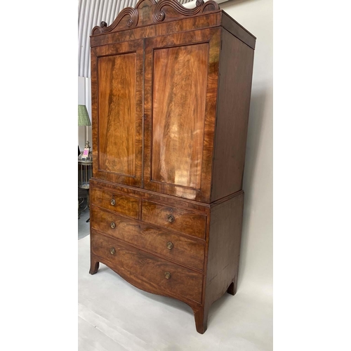 96 - LINEN PRESS, Regency flame mahogany, scroll cornice above two panelled doors (original slide trays) ... 