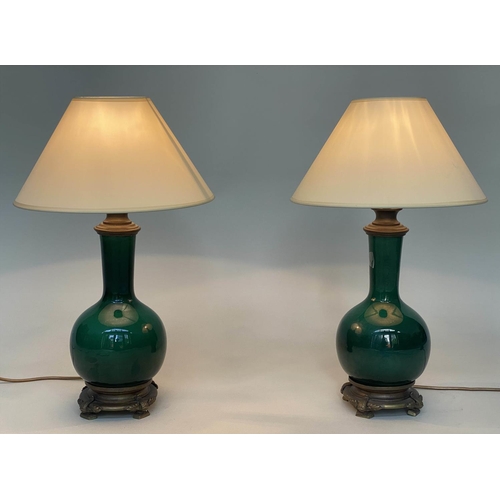 103 - TABLE LAMPS, a pair, Chinese emerald green ceramic and bronze mounted of gourd vase form with shades... 