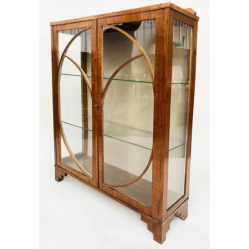 106 - ART DECO DISPLAY CABINET, walnut with two circular glazed doors enclosing shelves, 92cm x 131cm H x ... 