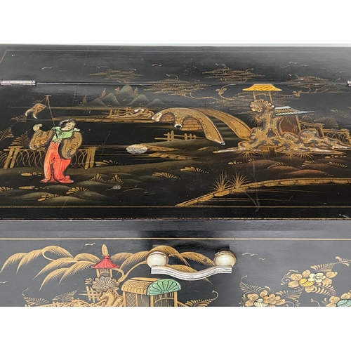 111 - ART DECO COCKTAIL CABINET, black lacquered and gilt polychrome Chinoiserie decorated with rising lid... 