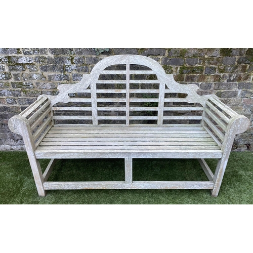 128 - LUTYENS STYLE GARDEN BENCH, weathered teak of slatted construction, 165cm W.