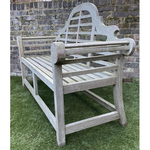 128 - LUTYENS STYLE GARDEN BENCH, weathered teak of slatted construction, 165cm W.