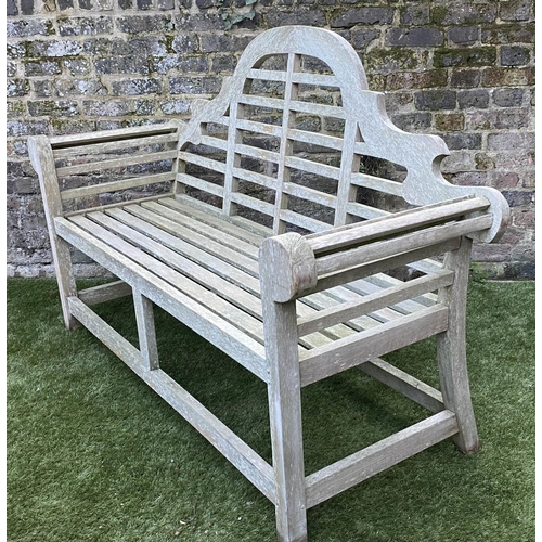 128 - LUTYENS STYLE GARDEN BENCH, weathered teak of slatted construction, 165cm W.