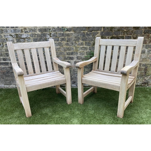 131 - GARDEN ARMCHAIRS, a pair, silvery weathered teak of substantial construction, 68cm W. (2)