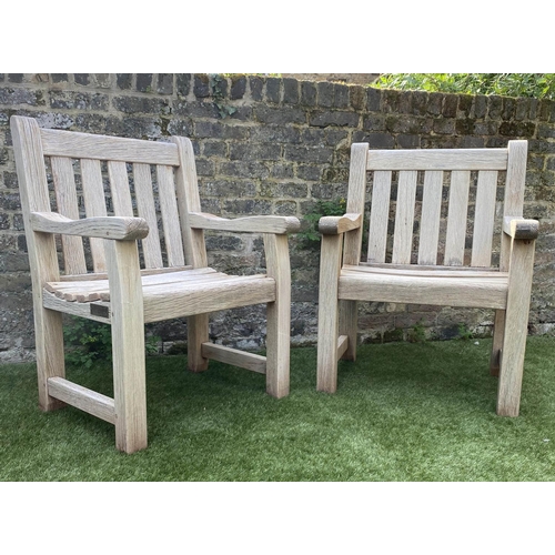 131 - GARDEN ARMCHAIRS, a pair, silvery weathered teak of substantial construction, 68cm W. (2)