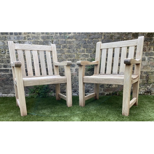 131 - GARDEN ARMCHAIRS, a pair, silvery weathered teak of substantial construction, 68cm W. (2)