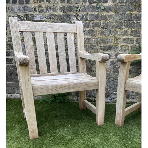 131 - GARDEN ARMCHAIRS, a pair, silvery weathered teak of substantial construction, 68cm W. (2)