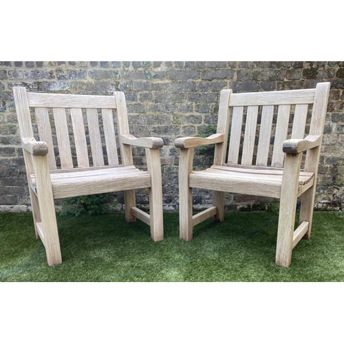 131 - GARDEN ARMCHAIRS, a pair, silvery weathered teak of substantial construction, 68cm W. (2)