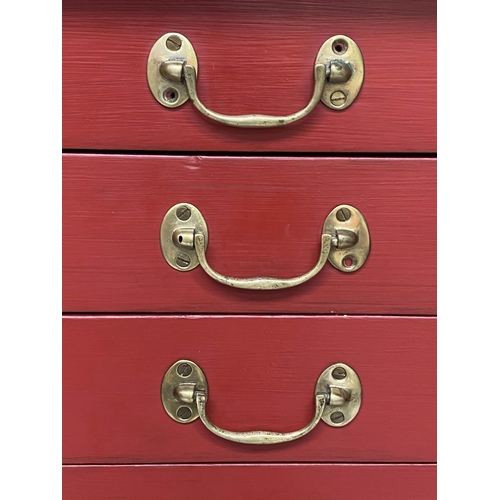 134 - BANK OF DRAWERS, early 20th century cardinal red painted with fifteen drawers and brass handles, 134... 