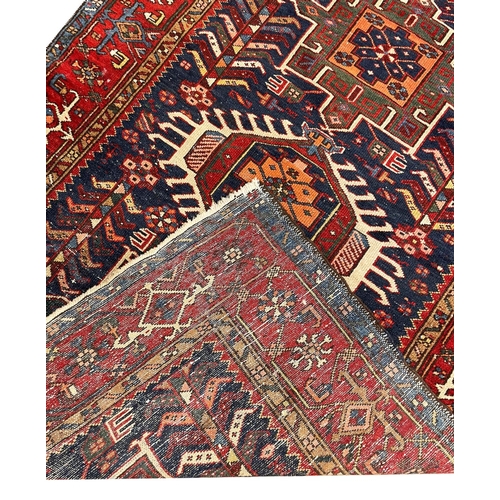 84 - ANTIQUE PERSIAN HERIZ RUG, 190cm x 142cm.