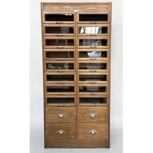 203 - HABERDASHERY CABINET, mid 20th century oak with sixteen glass fronted drawers above four short deep ... 