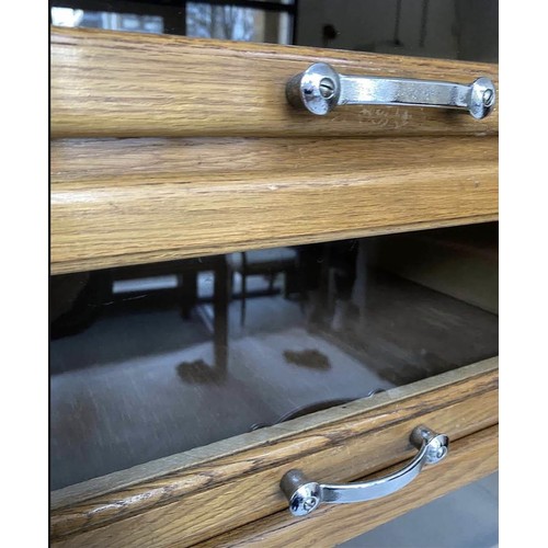 203 - HABERDASHERY CABINET, mid 20th century oak with sixteen glass fronted drawers above four short deep ... 