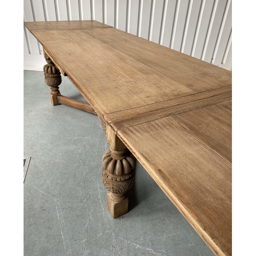 195 - DRAWLEAF REFECTORY DINING TABLE, rectangular solid oak with planked, cleated top on heavily carved s... 