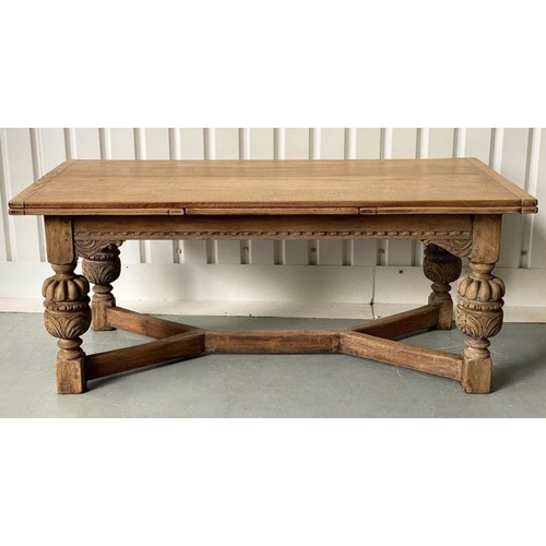 195 - DRAWLEAF REFECTORY DINING TABLE, rectangular solid oak with planked, cleated top on heavily carved s... 