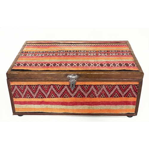 200 - KELIM TRUNK/TABLE, vintage kelim upholstered and leather bound with rising lid, 110cm x 70cm x 45cm ... 