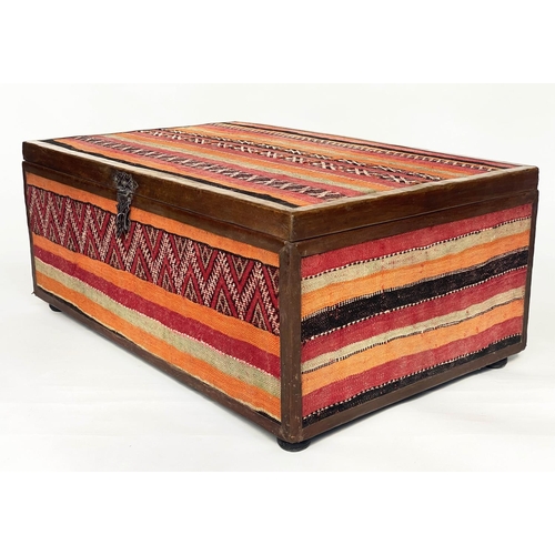 200 - KELIM TRUNK/TABLE, vintage kelim upholstered and leather bound with rising lid, 110cm x 70cm x 45cm ... 