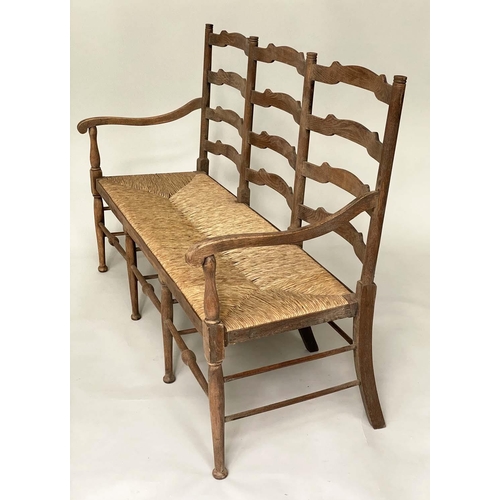 118 - HALL SEAT, early 20th century English oak with raised ladder back and rush seat, 157cm W.