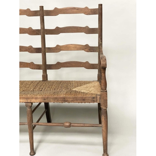 118 - HALL SEAT, early 20th century English oak with raised ladder back and rush seat, 157cm W.