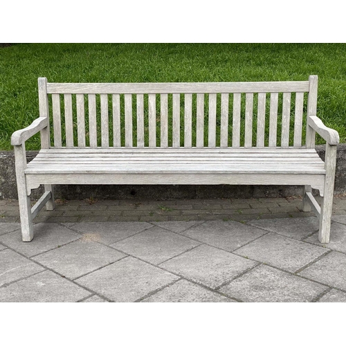 126 - GARDEN BENCH, silvery weathered teak of slatted and pegged construction, 180cm W.