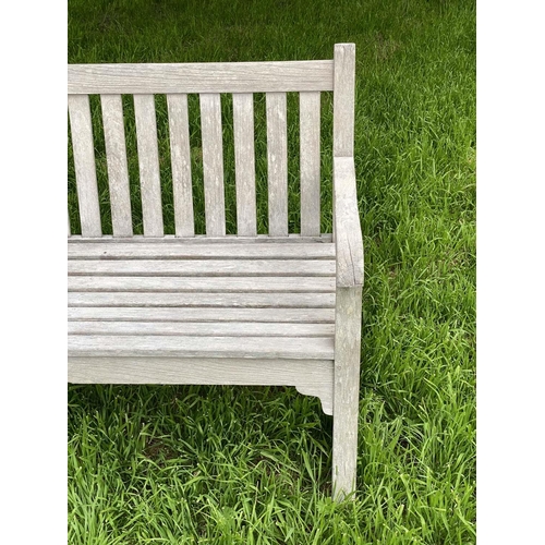 126 - GARDEN BENCH, silvery weathered teak of slatted and pegged construction, 180cm W.