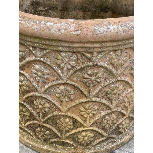 127 - GARDEN PLANTERS, a pair, weathered terracotta with flower motif, 50cm W. (2)