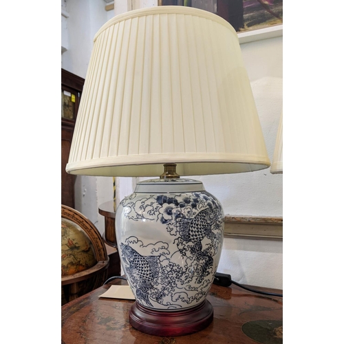 390 - TABLE LAMPS, a pair, Chinese export style blue and white ceramic, each 51cm tall with shades. (2)