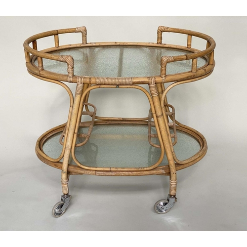 96 - CANE TROLLEY/TABLE, 1950s style rattan and cane bound, two tier and glazed.