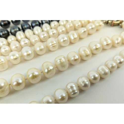 4 - FOUR FRESHWATER PEARL NECKLACES, comprising three white pearl necklaces and one peacock pearl neckla... 