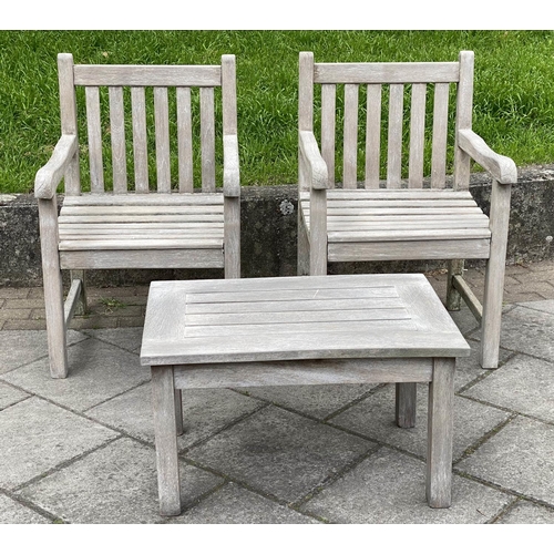 128 - GARDEN ARMCHAIRS AND TABLE, a pair, weathered teak of slatted and pegged construction, 61cm W togeth... 