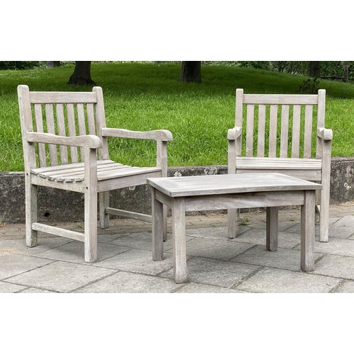 128 - GARDEN ARMCHAIRS AND TABLE, a pair, weathered teak of slatted and pegged construction, 61cm W togeth... 