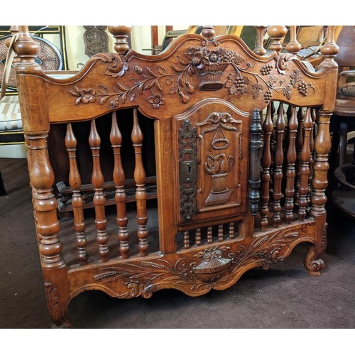 129 - A FRENCH WALNUT PANETIERE, probably 19th century carved frieze spindle gallery front and sides, sing... 